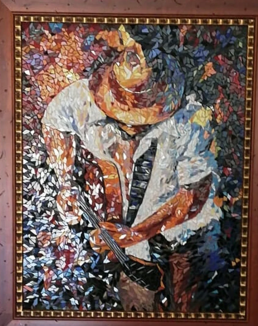 Mosaico de músico con guitarra